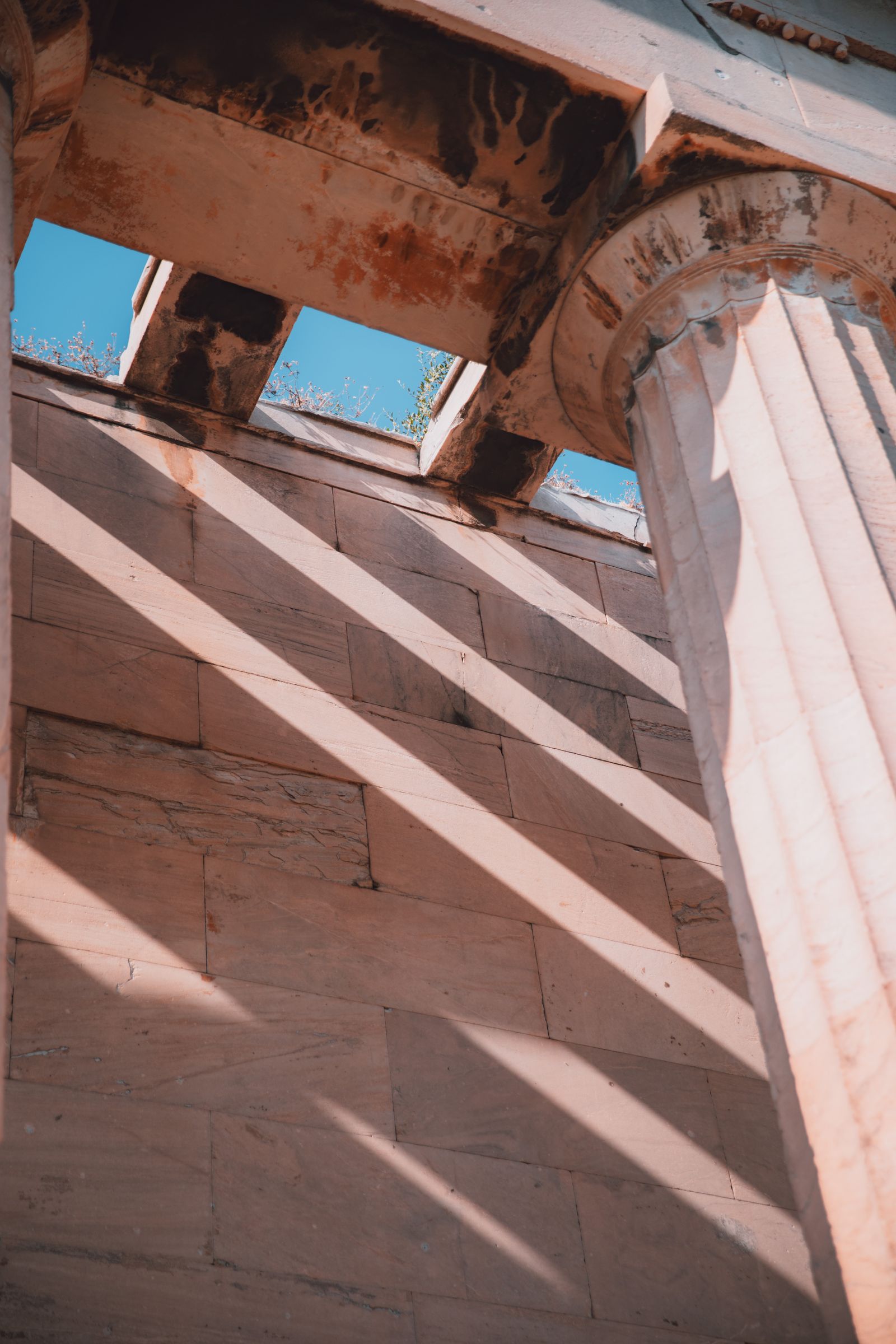 Marble columns and hard shadow lines at the Acropolis.
