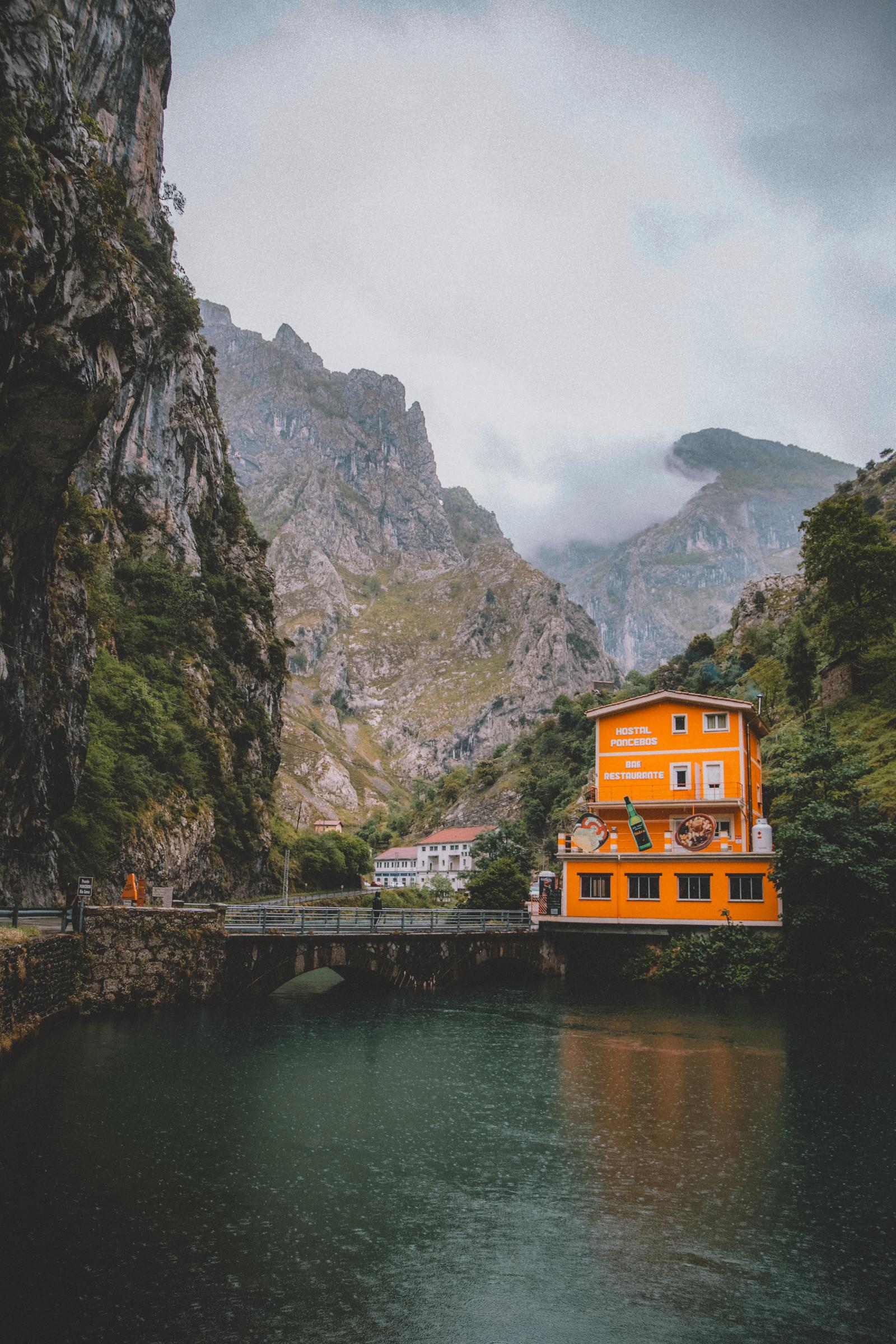 The orange Hostal Poncebos wedged into the Cares Gorge, Asturias.